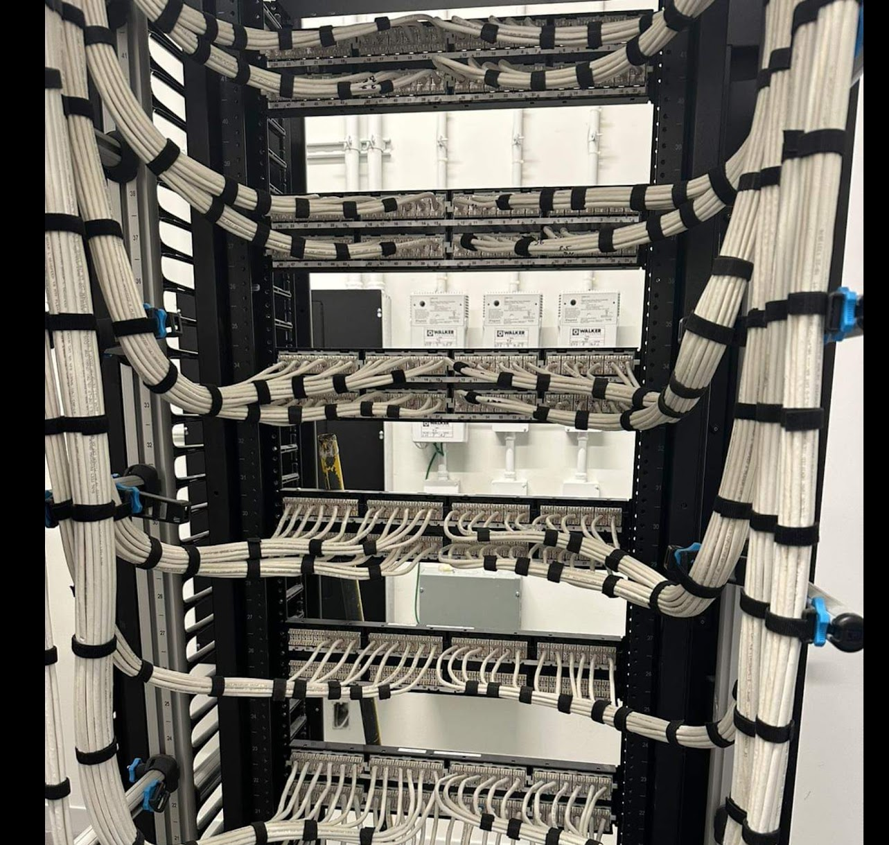 Professional network rack installation with neatly organized structured cabling